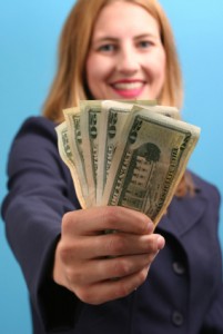 money smiling girl holding out money